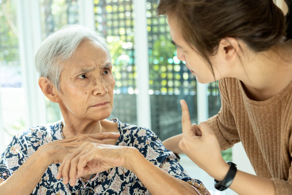young woman talking to a grandma