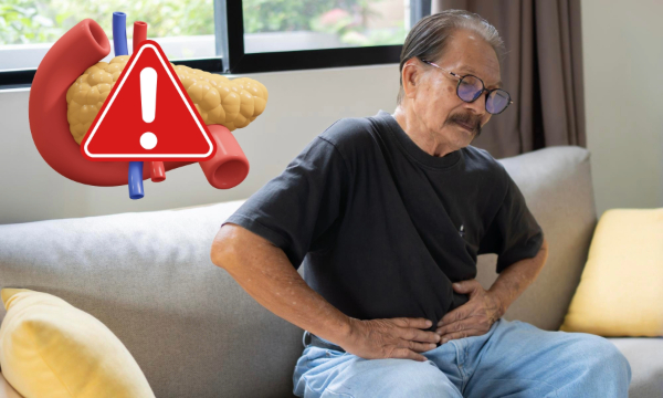 old man with his hands on his stomach