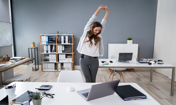 woman stretching during work